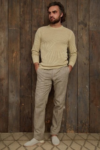 Beige Crew-neck Sweater Outfits For Men: If you use a more relaxed approach to styling, why not wear a beige crew-neck sweater with khaki linen chinos? If you wish to immediately level up your outfit with shoes, add a pair of grey canvas loafers to the equation.