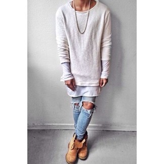 Light Blue Ripped Skinny Jeans Outfits For Men: The combo of a beige crew-neck sweater and light blue ripped skinny jeans makes for a solid laid-back ensemble. Complete this getup with tan suede work boots to tie your full look together.