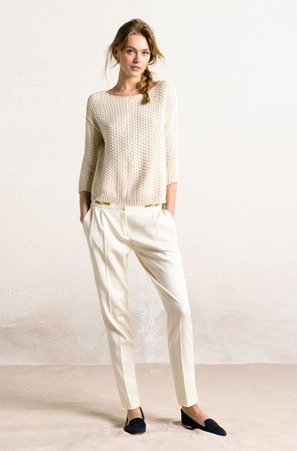 Why not marry a beige crew-neck sweater with white tapered pants? These pieces are very comfortable and look good when combined together. A chic pair of black suede loafers is an effective way to upgrade this outfit.
