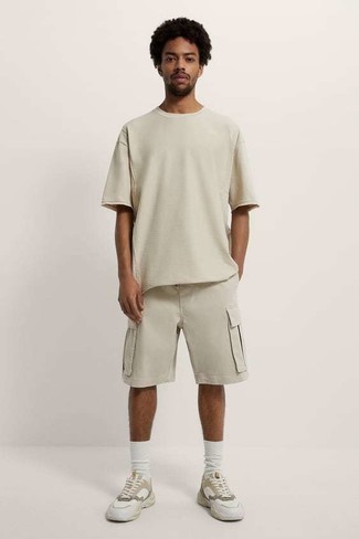 Tan Sports Shorts Outfits For Men: Choose a beige crew-neck t-shirt and tan sports shorts if you're scouting for an outfit idea for when you want to look cool and relaxed. This look is rounded off nicely with beige athletic shoes.