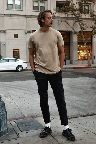 Black Chunky Leather Derby Shoes Outfits: For a look that's pared-down but can be modified in plenty of different ways, opt for a beige crew-neck t-shirt and black chinos. Up the ante of your look by finishing with a pair of black chunky leather derby shoes.