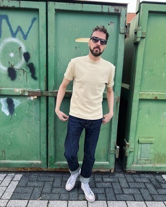 Beige Crew-neck T-shirt Outfits For Men: For a laid-back look with a modern finish, you can easily opt for a beige crew-neck t-shirt and navy jeans. To bring out the fun side of you, complement your getup with a pair of white canvas high top sneakers.