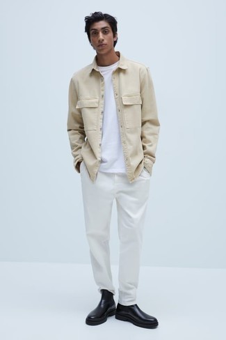Tan Denim Shirt Outfits For Men: This pairing of a tan denim shirt and white chinos is super versatile and really apt for whatever the day throws at you. A pair of black leather chelsea boots will elevate this outfit.