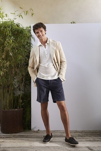 Beige Double Breasted Blazer Outfits For Men: Pairing a beige double breasted blazer and navy shorts will prove your expertise in men's fashion. A cool pair of black leather boat shoes is a simple way to add a touch of stylish nonchalance to this ensemble.