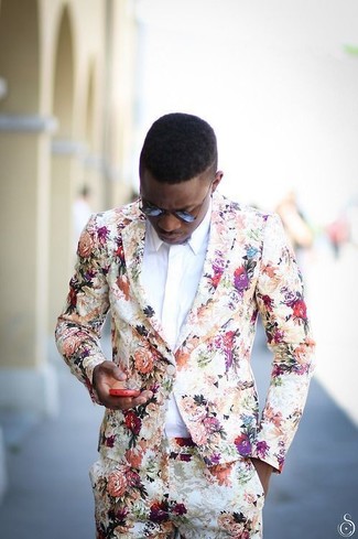 Floral Blazer Outfits For Men: For a neat and relaxed ensemble, go for a floral blazer and beige floral chinos — these two pieces fit brilliantly together.