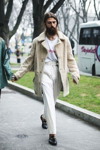 Beige Fur Coat Outfits For Men: This combo of a beige fur coat and white chinos is proof that a safe casual getup can still look truly dapper. Feel uninspired with this outfit? Enter a pair of black leather loafers to spice things up.