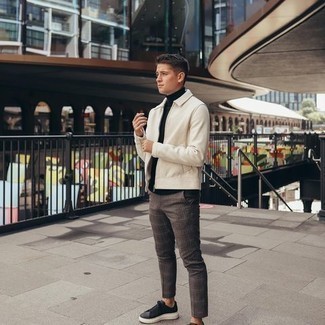 Brown Plaid Chinos Outfits: For a look that brings practicality and dapperness, pair a beige harrington jacket with brown plaid chinos. Let your expert styling really shine by completing your ensemble with a pair of black canvas low top sneakers.