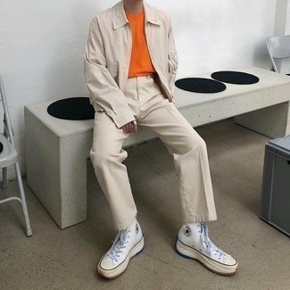 Orange Crew-neck T-shirt Outfits For Men: An orange crew-neck t-shirt and beige chinos are a combination that every style-conscious guy should have in his casual collection. To bring a laid-back feel to this ensemble, introduce a pair of white canvas high top sneakers to this look.