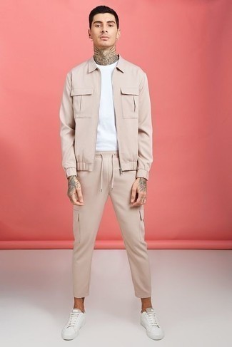 Beige Cargo Pants Outfits: This laid-back and cool look is so simple: a beige harrington jacket and beige cargo pants. Add a pair of white canvas low top sneakers to the equation and the whole ensemble will come together.