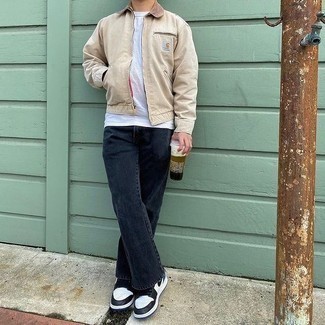 White and Black Leather Low Top Sneakers Outfits For Men: For a fail-safe laid-back option, you can rely on this pairing of a beige harrington jacket and charcoal jeans. White and black leather low top sneakers are the glue that will bring your look together.