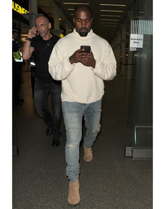 Kanye West wearing Beige Hoodie, Blue Ripped Skinny Jeans, Beige Suede Chelsea Boots