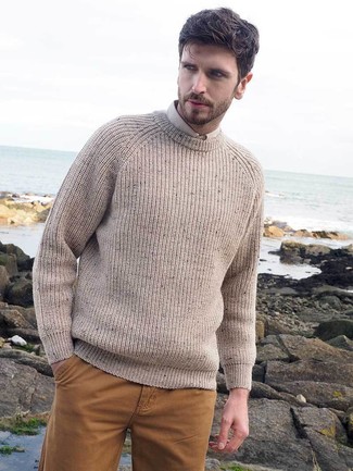 Beige Crew-neck Sweater Outfits For Men: A beige crew-neck sweater and mustard chinos paired together are a sartorial dream for those dressers who love laid-back and cool styles.