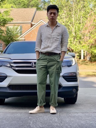 Tan Long Sleeve Shirt Outfits For Men: If you're on the lookout for an off-duty yet sharp ensemble, try pairing a tan long sleeve shirt with olive cargo pants. A pair of beige canvas low top sneakers acts as the glue that brings this look together.