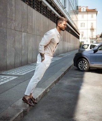 Gold Watch Outfits For Men: If you're on the hunt for a bold casual yet on-trend getup, opt for a beige long sleeve shirt and a gold watch. Want to play it up on the shoe front? Introduce a pair of brown leather tassel loafers to your outfit.