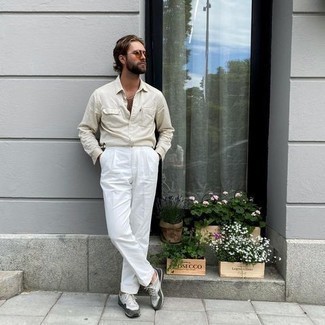 White Dress Pants Outfits For Men: A beige long sleeve shirt and white dress pants are essential in any modern gent's closet. Round off with a pair of grey athletic shoes to power up this look.