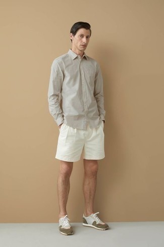 Beige Long Sleeve Shirt Outfits For Men: This casual combination of a beige long sleeve shirt and white shorts is a life saver when you need to look cool and casual in a flash. Dial up your outfit by rocking olive athletic shoes.