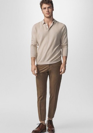 Beige Polo Neck Sweater Outfits For Men: Such essentials as a beige polo neck sweater and brown chinos are the perfect way to infuse a touch of masculine refinement into your daily casual wardrobe. You can get a little creative with shoes and complement your ensemble with brown leather derby shoes.