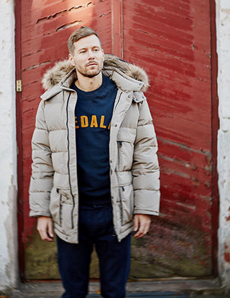 Tan Puffer Coat Outfits For Men: This off-duty combo of a tan puffer coat and navy jeans couldn't possibly come across other than devastatingly stylish.