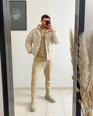 Beige Puffer Jacket Outfits For Men: In situations comfort is top priority, this combo of a beige puffer jacket and a beige track suit is a no-brainer. Up the style ante of your outfit by finishing off with beige suede chelsea boots.