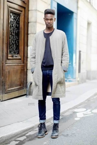 Charcoal Leather Casual Boots Outfits For Men: You'll be surprised at how very easy it is for any gent to get dressed like this. Just a beige raincoat and navy jeans. A pair of charcoal leather casual boots instantly ramps up the style factor of any outfit.