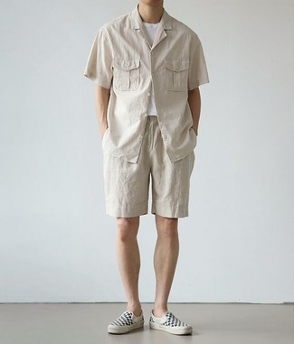 Black Canvas Slip-on Sneakers Outfits For Men: A beige short sleeve shirt and beige shorts are indispensable menswear staples if you're piecing together a casual wardrobe that holds to the highest sartorial standards. A pair of black canvas slip-on sneakers is a savvy idea to complement this ensemble.