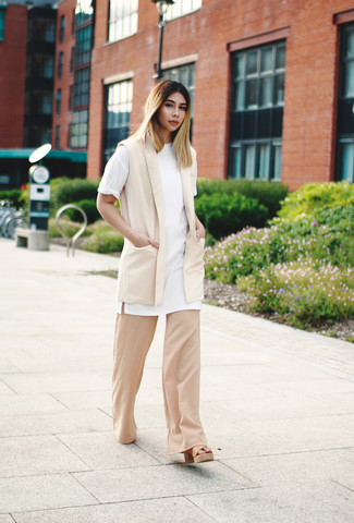 Tan Wide Leg Pants Outfits: If you prefer a more relaxed approach to fashion, why not reach for a beige sleeveless blazer and tan wide leg pants? And if you want to easily lift up this outfit with shoes, why not add tan leather heeled sandals to the mix?