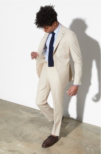 Beige Suit Outfits: Teaming a beige suit with a light blue vertical striped dress shirt is a good choice for a stylish and elegant ensemble. Dial up this look with a pair of dark brown leather desert boots.