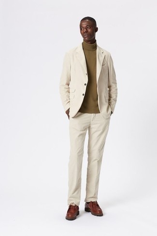 Brown Leather Desert Boots Outfits: Loving how this pairing of a beige suit and an olive turtleneck immediately makes any man look stylish and sophisticated. Break up this look by sporting a pair of brown leather desert boots.