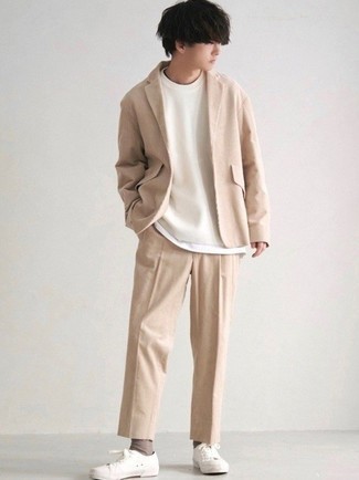 Beige Suit Outfits: For an outfit that's worthy of a modern style-savvy guy and effortlessly classic, try teaming a beige suit with a white crew-neck t-shirt. For a more casual feel, complement this ensemble with a pair of white canvas low top sneakers.