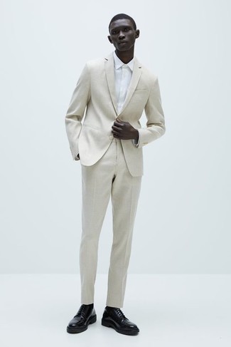 Beige Suit Outfits: To look smooth and sharp, make a beige suit and a white dress shirt your outfit choice. Introduce black leather derby shoes to the mix to add a dose of stylish effortlessness to your ensemble.