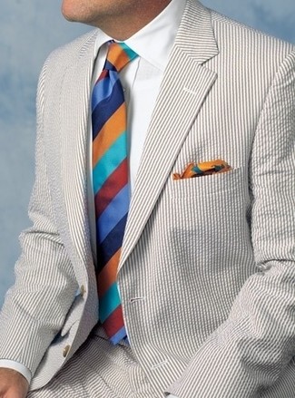 Multi colored Print Pocket Square Outfits: This pairing of a beige seersucker suit and a multi colored print pocket square is very easy to put together and so comfortable to sport all day long as well!