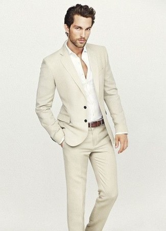 A beige suit and a white long sleeve shirt are among the crucial items in a great man's closet.