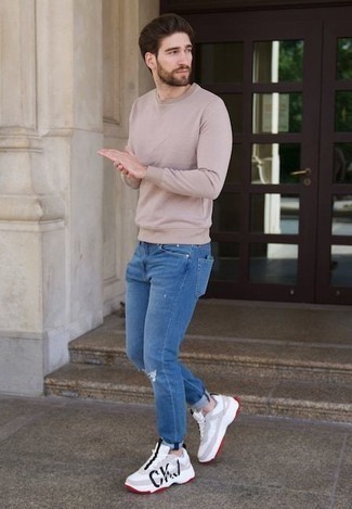 Navy Ripped Jeans Outfits For Men: A beige sweatshirt and navy ripped jeans are a cool look worth having in your daily arsenal. Dial down the formality of your ensemble by finishing with a pair of white and black athletic shoes.