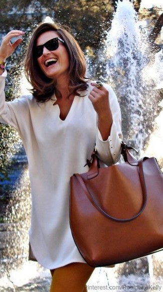 Tobacco Leather Tote Bag Outfits: Marry a beige swing dress with a tobacco leather tote bag to achieve new levels in outfit coordination.
