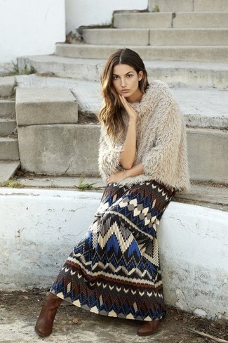 A beige textured poncho and a multi colored print maxi dress have proven themselves as bona fide essentials. Add brown leather knee high boots to your ensemble to switch things up.