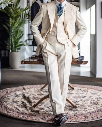 Beige Three Piece Suit Outfits: Marry a beige three piece suit with a light blue vertical striped dress shirt for manly sophistication with a contemporary spin. Complement your getup with a pair of dark brown leather brogues to add a hint of stylish nonchalance to this outfit.