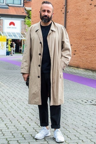 Tan Trenchcoat Outfits For Men: Team a tan trenchcoat with black chinos for effortless refinement with a rugged finish. For something more on the casually cool side to complement this ensemble, complete this ensemble with white athletic shoes.