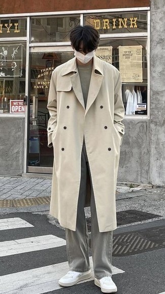 Beige Trenchcoat Outfits For Men: A beige trenchcoat and grey jeans are definitely worth adding to your list of veritable menswear staples. You can get a bit experimental on the shoe front and dress down your ensemble with a pair of white canvas low top sneakers.