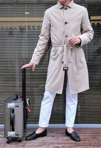 Suitcase Outfits For Men: Why not try pairing a beige trenchcoat with a suitcase? Both pieces are very comfortable and look awesome paired together. Complete this outfit with black leather loafers for an extra touch of style.