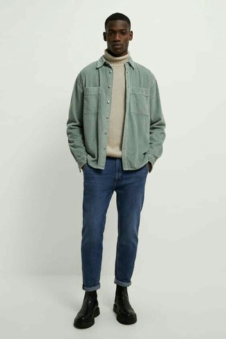 500+ Spring Outfits For Men: This outfit with a beige wool turtleneck and navy jeans isn't so hard to score and is easy to adapt according to circumstances. Why not take a classic approach with shoes and add black leather chelsea boots to the equation? So if you're looking for a look that's sharp but also feels entirely spring-appropriate, this one fits the task well.