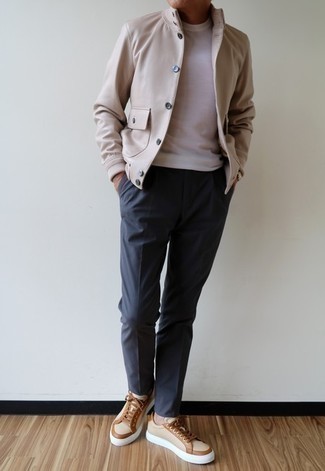 Tan Varsity Jacket Outfits For Men: This look with a tan varsity jacket and navy chinos isn't so hard to pull off and leaves room to more experimentation. If you don't know how to finish, a pair of beige canvas low top sneakers is a nice pick.