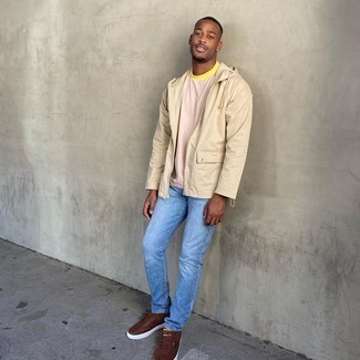 Tan Windbreaker Outfits For Men: If you like comfort dressing, consider pairing a tan windbreaker with light blue jeans. Complement your ensemble with brown leather low top sneakers for extra style points.