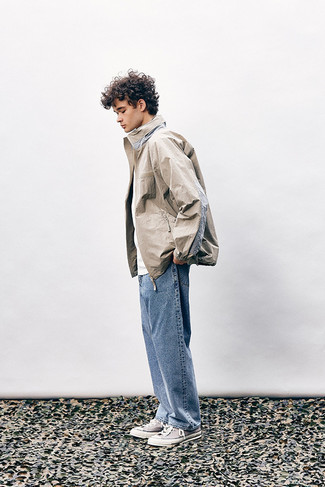 Men's Outfits 2022: If you gravitate towards relaxed style, why not opt for a beige windbreaker and light blue jeans? Complete this look with a pair of beige canvas high top sneakers to easily up the appeal of your outfit.