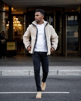 Tan Fleece Zip Sweater Outfits For Men: This relaxed casual combo of a tan fleece zip sweater and black jeans couldn't possibly come across as anything other than devastatingly dapper. Tap into some Ryan Gosling dapperness and introduce a pair of beige suede chelsea boots to this ensemble.