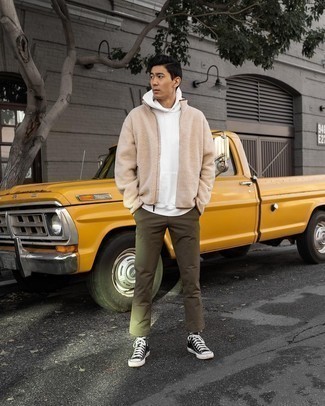 Tan Fleece Zip Sweater Outfits For Men: For an outfit that's super easy but can be modified in a great deal of different ways, try pairing a tan fleece zip sweater with olive chinos. And if you need to effortlessly play down this ensemble with one item, why not introduce a pair of black and white canvas high top sneakers to the equation?