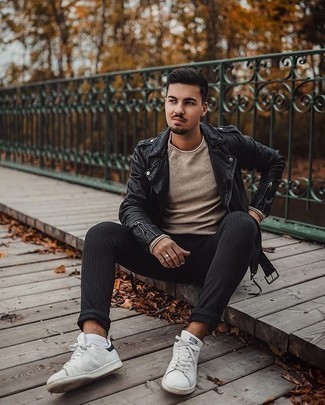 Beige Crew-neck Sweater with White and Black Leather Low Top Sneakers Casual Outfits For Men: A beige crew-neck sweater and black vertical striped chinos have become bona fide casual styles for most guys. Now all you need is a great pair of white and black leather low top sneakers.