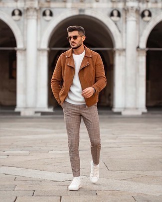 Brown Plaid Chinos Outfits: This off-duty combo of a brown suede biker jacket and brown plaid chinos couldn't possibly come across as anything other than incredibly stylish. This outfit is completed really well with white canvas low top sneakers.