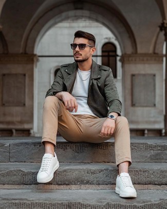 Olive Suede Biker Jacket Outfits For Men: If it's ease and practicality that you appreciate in a look, make an olive suede biker jacket and khaki chinos your outfit choice. When it comes to footwear, this look is completed well with white leather low top sneakers.