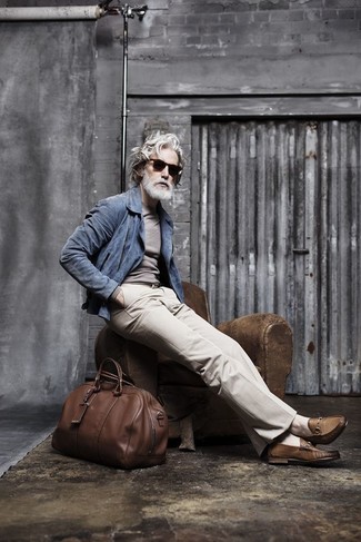 Such essentials as a blue suede biker jacket and beige dress pants are an easy way to introduce a dose of masculine elegance into your casual collection. And if you need to instantly ramp up this ensemble with one single item, why not complete this look with a pair of brown leather loafers?