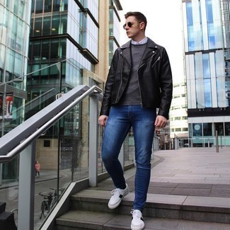 White and Red Leather Low Top Sneakers Outfits For Men: Putting together a black leather biker jacket with navy skinny jeans is an on-point idea for a laid-back outfit. A good pair of white and red leather low top sneakers is an effortless way to transform this look.